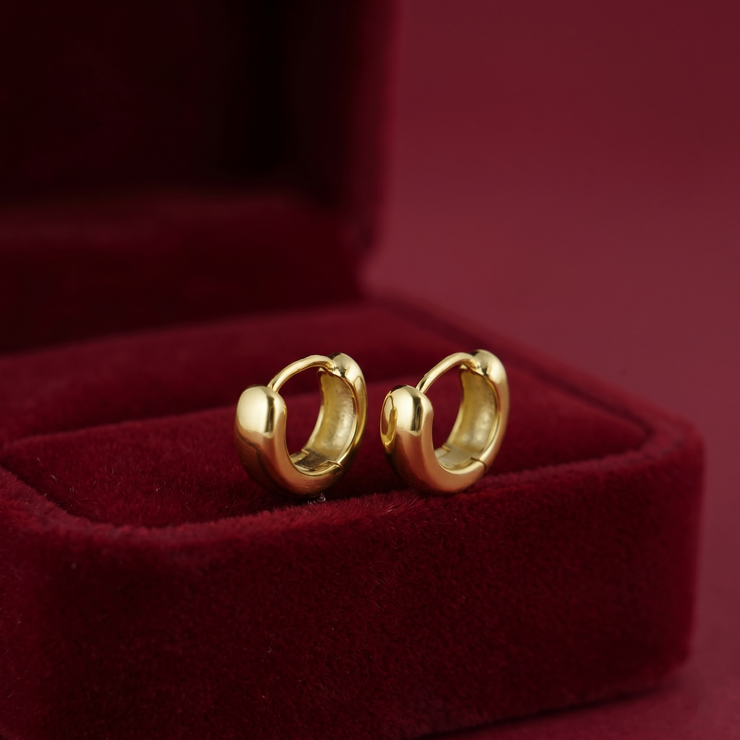 Gold sleeper huggie earrings with hinged clasp, set of two