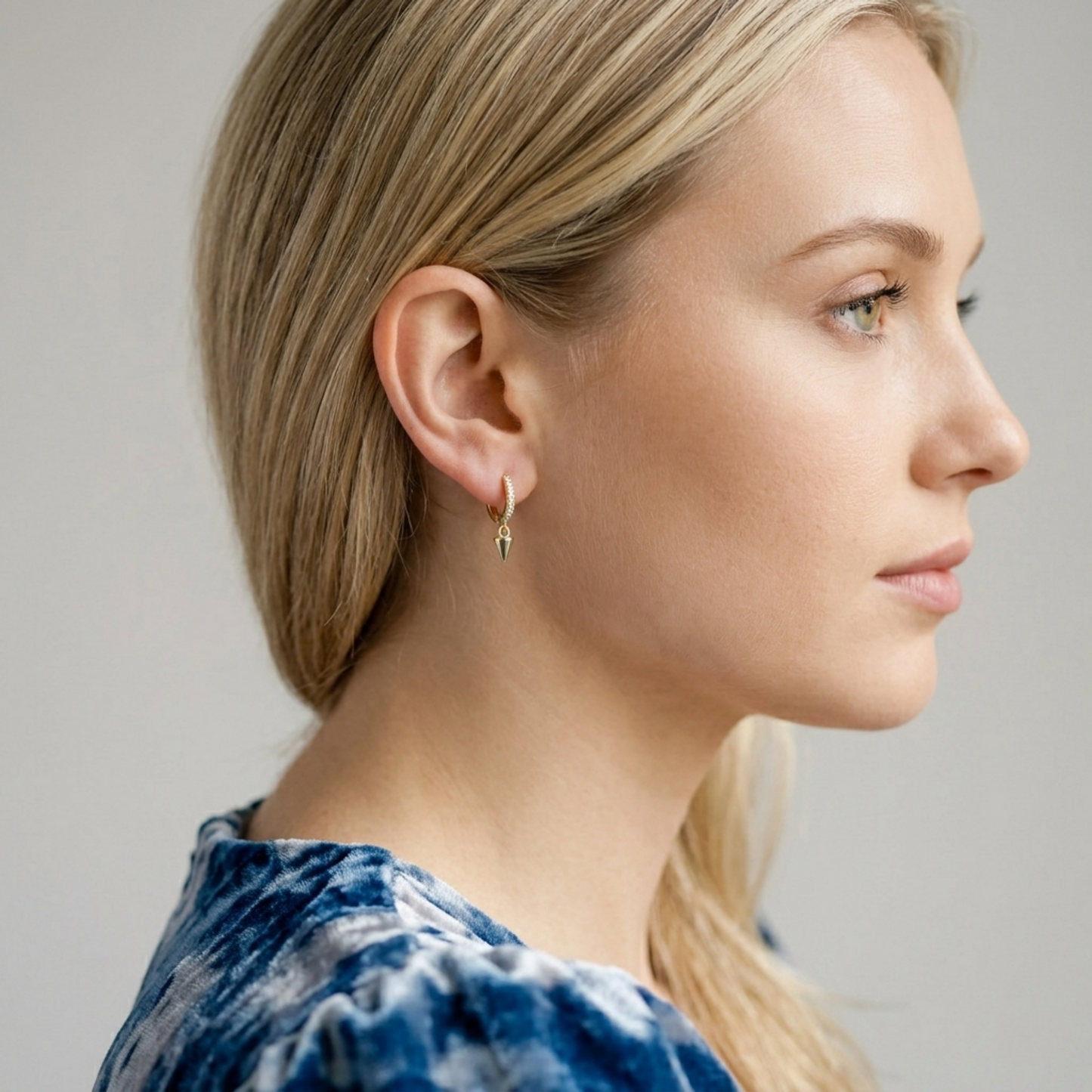 Rose gold cone-spike hoop earrings with small dangling point charms