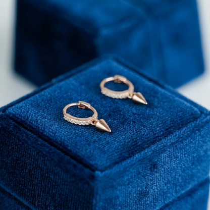 Rose gold and silver cone-spike hoop earrings with pavé sparkle and pointed charms