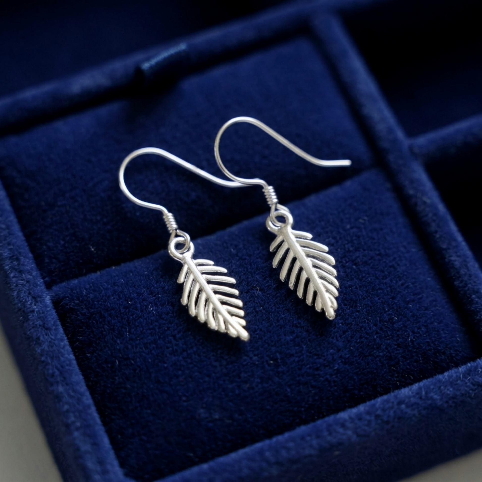 Leaf drop hook earrings with dangling leaf charms, silver tone