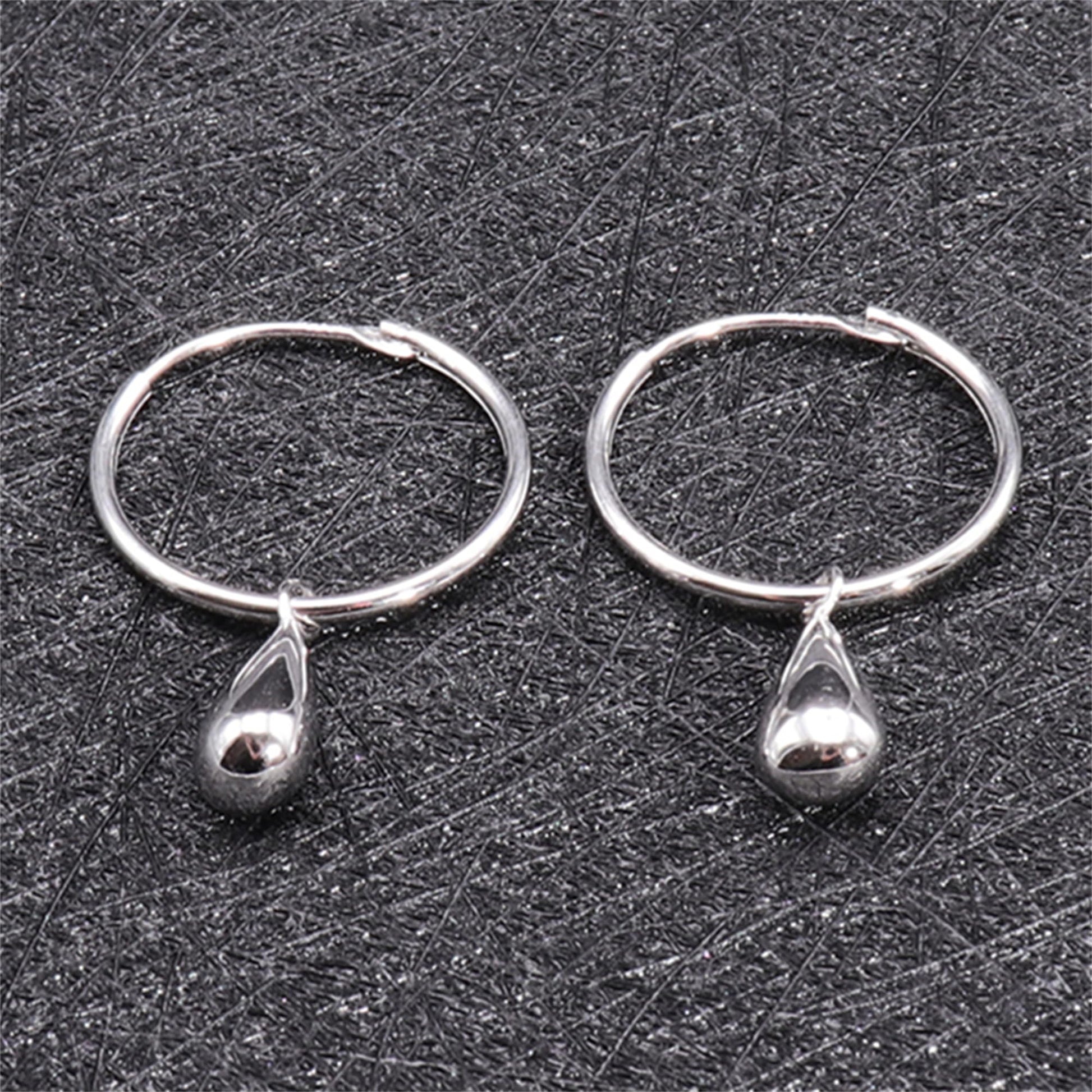 Silver teardrop hoop earrings, close-up showing hoop and teardrop charm