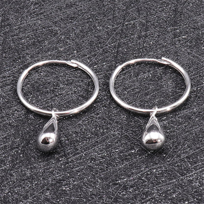 Silver teardrop hoop earrings, close-up showing hoop and teardrop charm