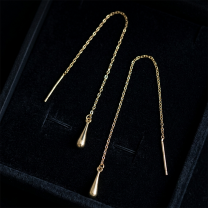 Gold-tone teardrop threader earrings with teardrop drops and long chain in box