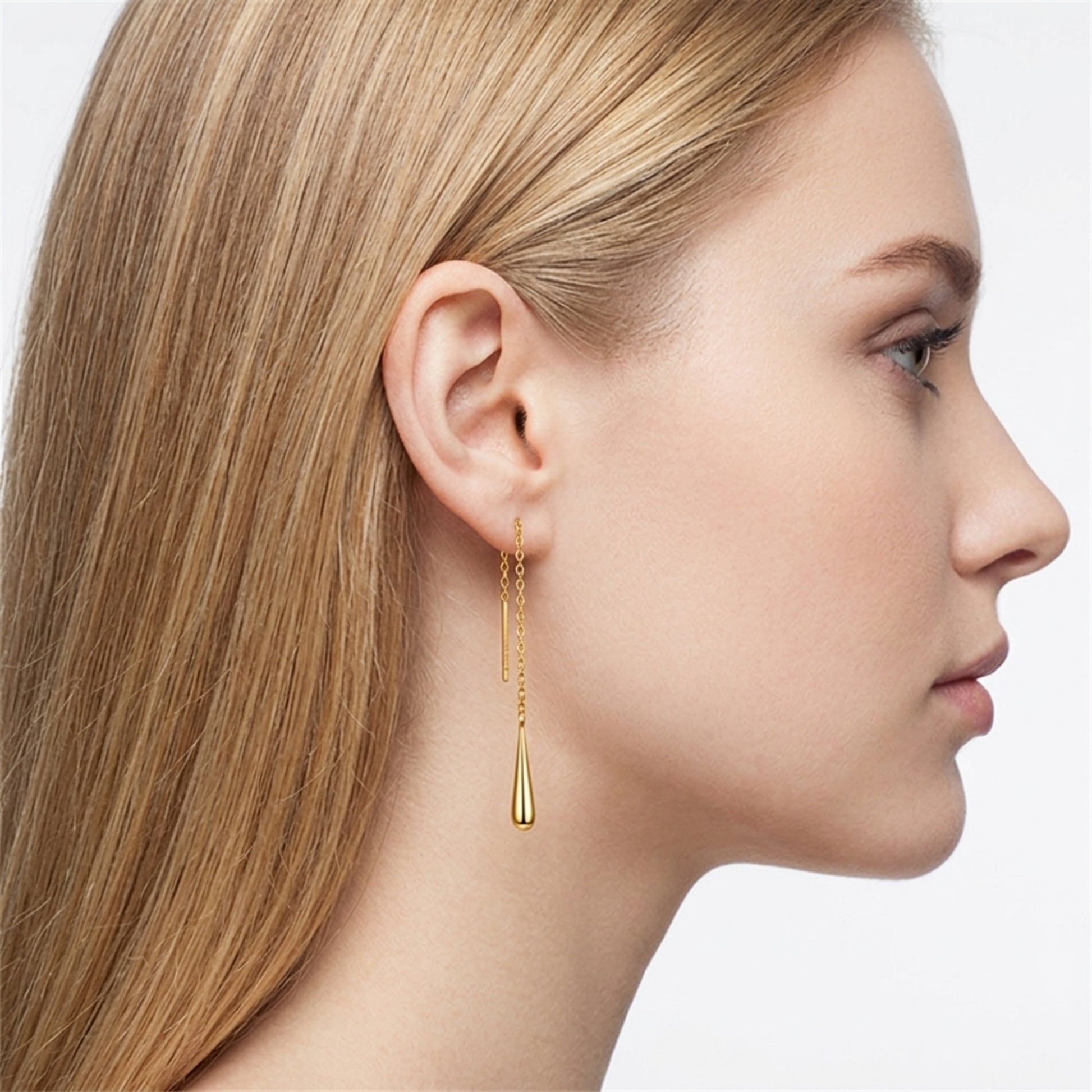 Gold-tone teardrop threader earrings on model, long chain with teardrop drop