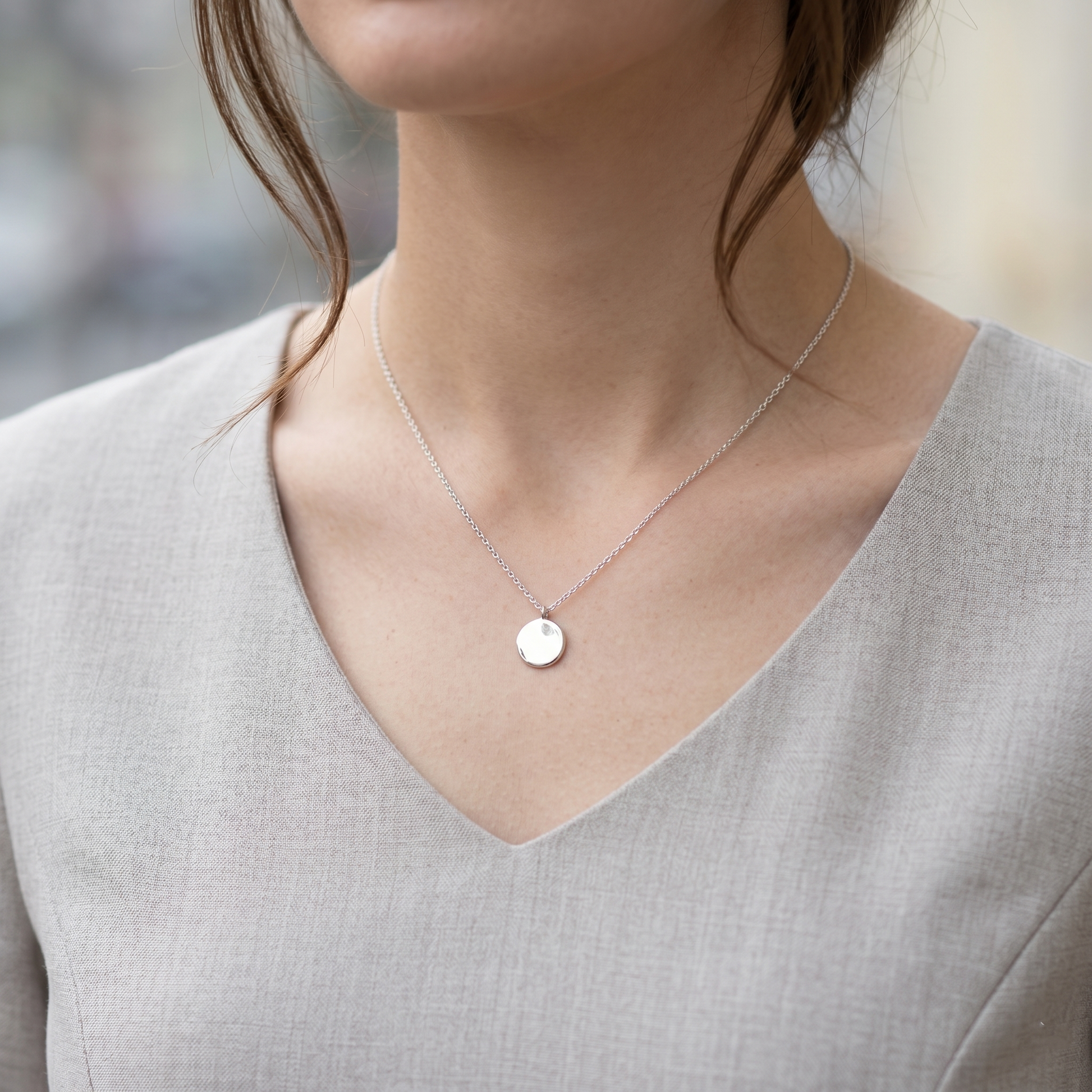 Minimal Disc Necklace worn: rhodium-silver round pendant on thin chain