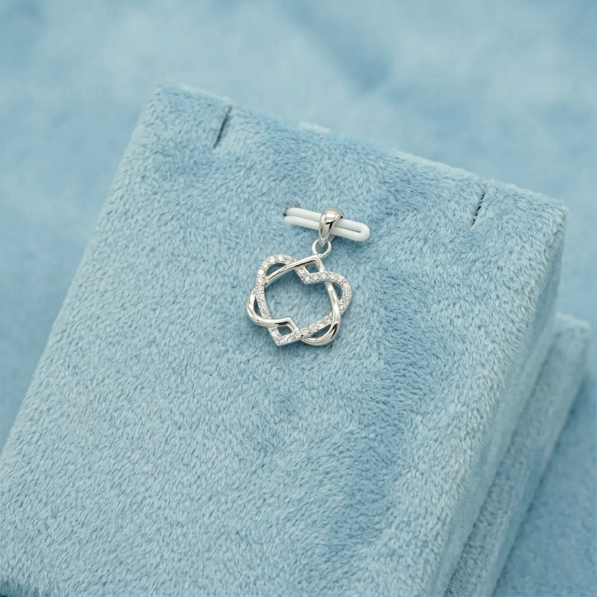Silver heart knot pendant necklace with bar clasp detail