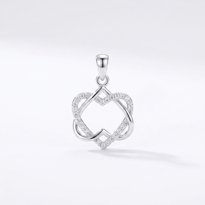 Silver heart knot pendant necklace with clear stone-like accents