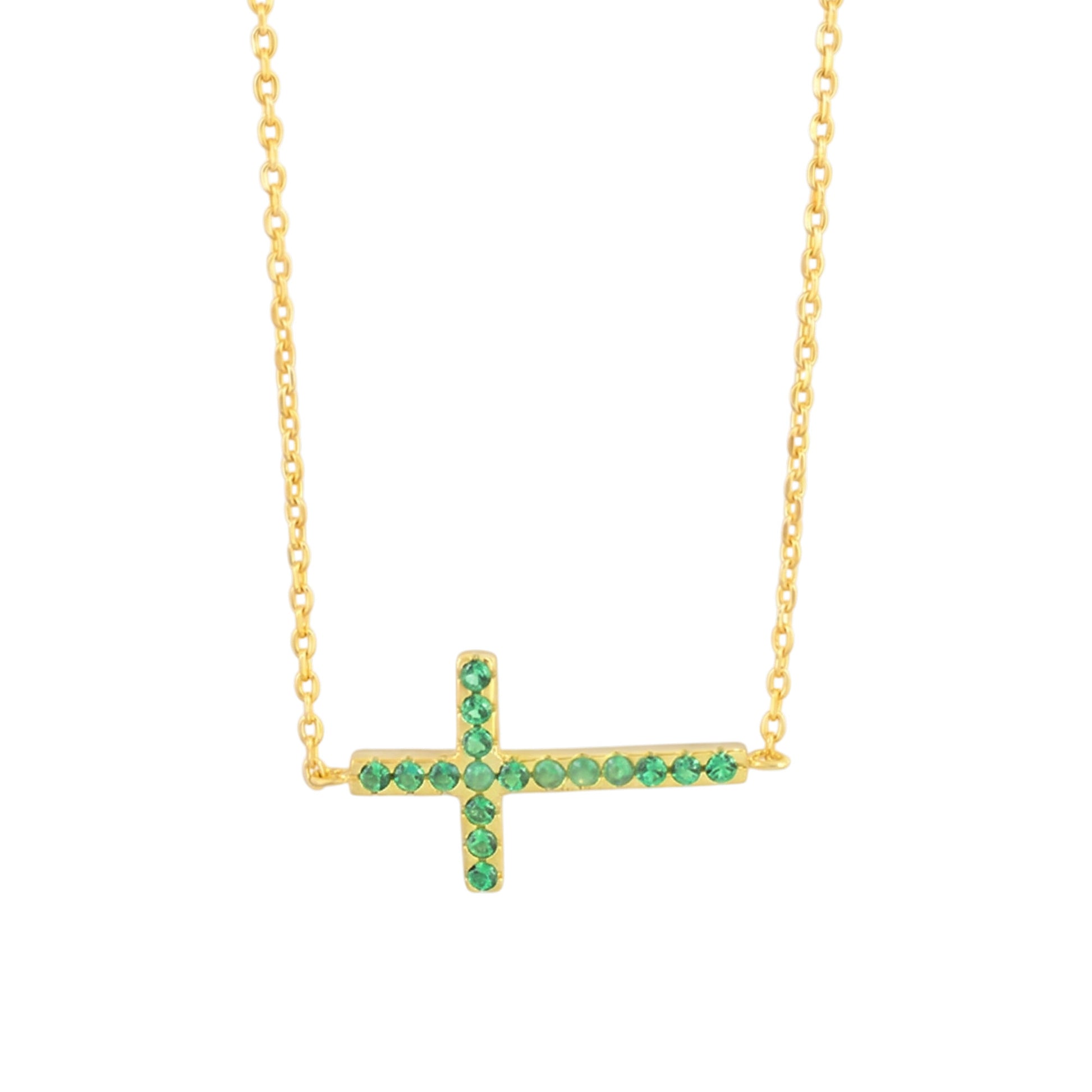 Gold-tone cross necklace with green crystal stones on a fine chain