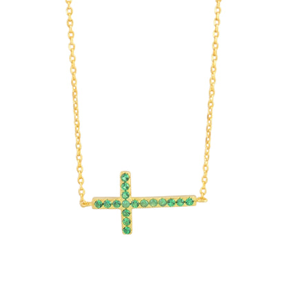 Gold-tone cross necklace with green crystal stones on a fine chain