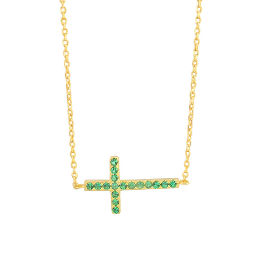 Sideways cross CZ necklace with green stones on a gold-tone chain