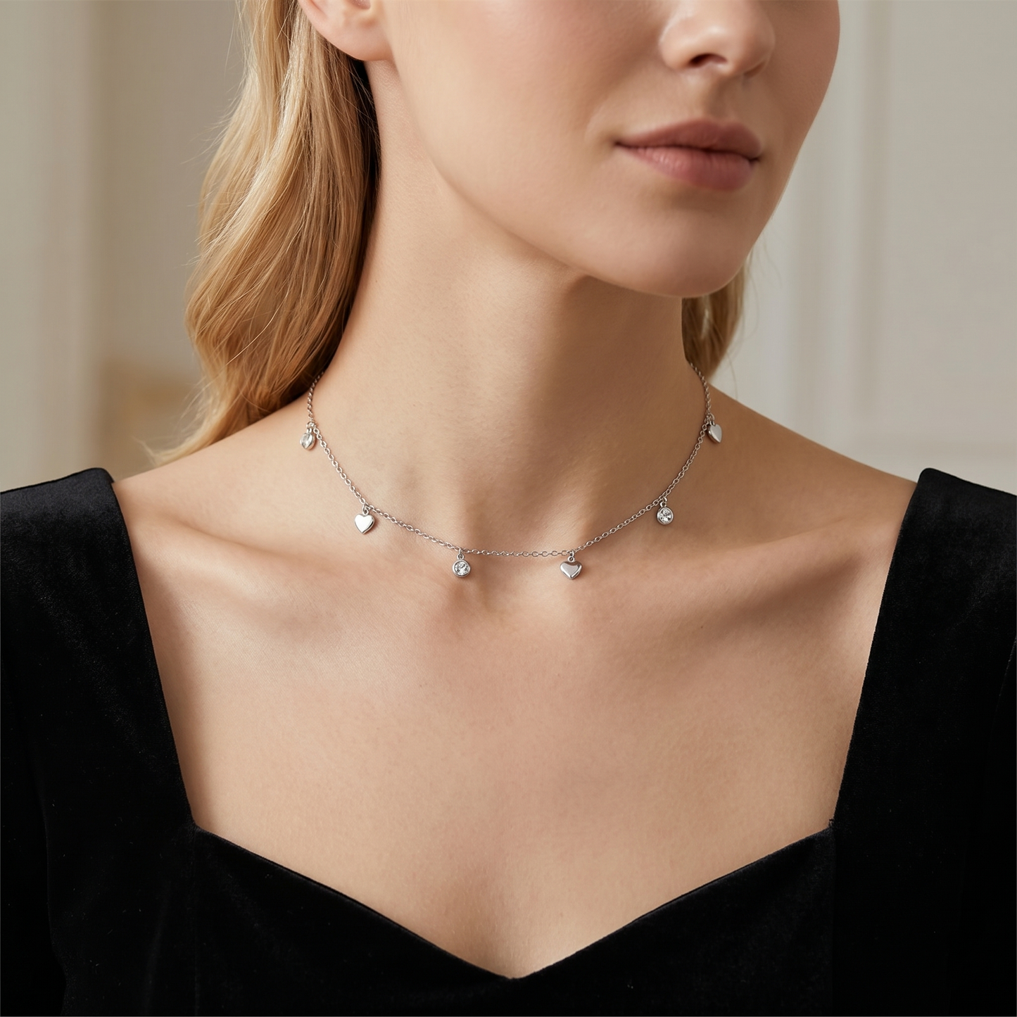 Silver-tone heart CZ choker with multiple heart drops and round CZ circle accents