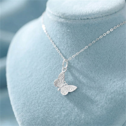 Silver butterfly charm pendant on a chain necklace with loop bail