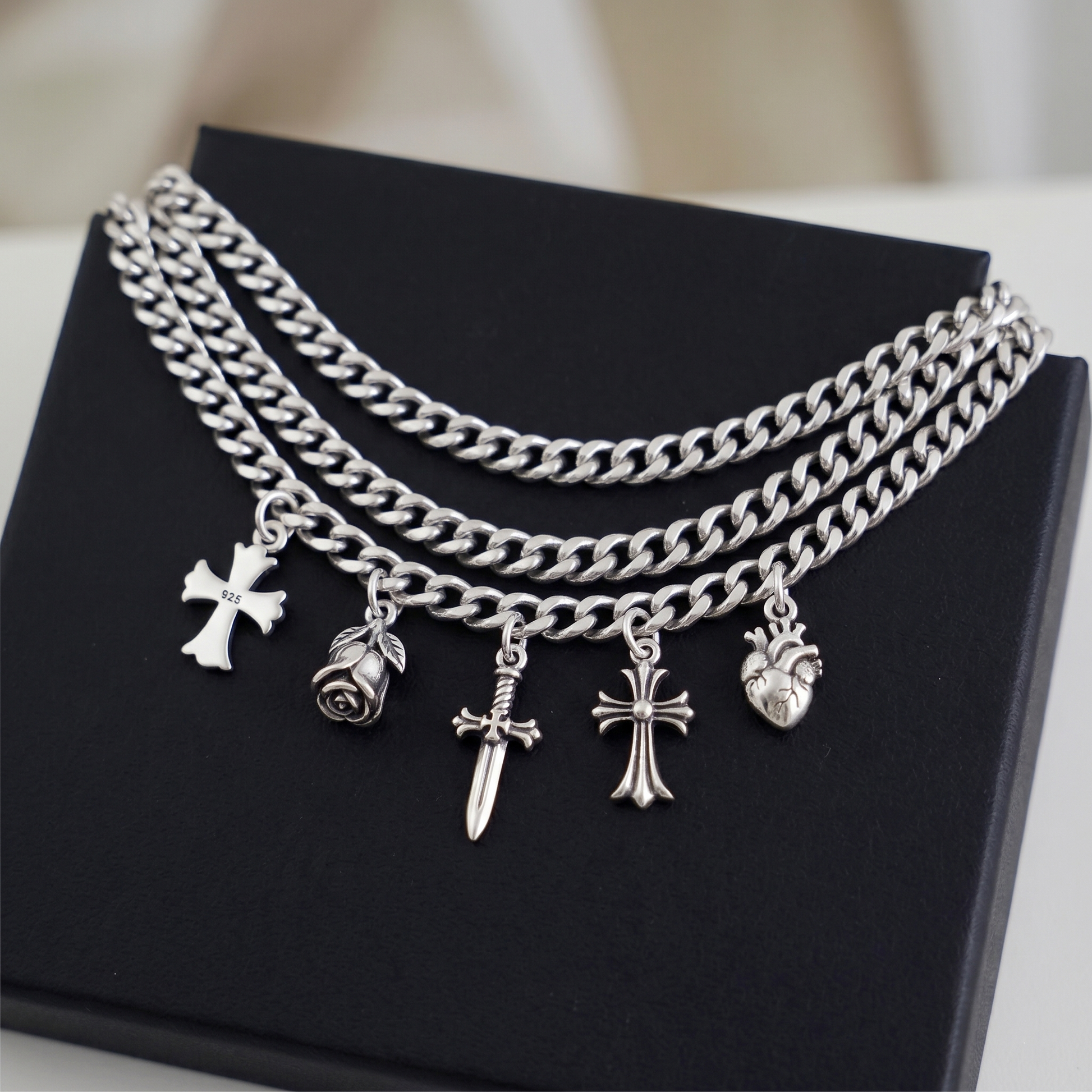Heritage fleur-de-lis cross charm necklace with multiple charms, silver tone chain