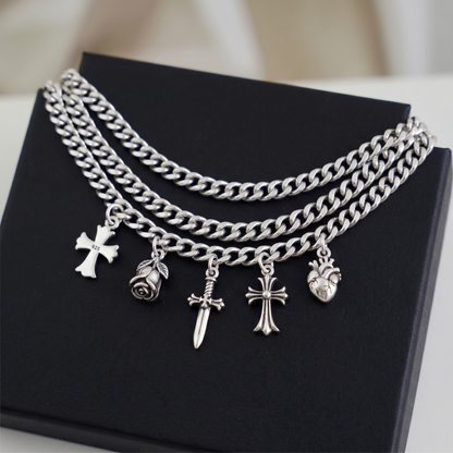 Heritage fleur-de-lis cross charm necklace with multiple charms, silver tone chain