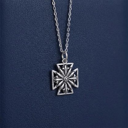 Oxidised Maltese star pendant on hanging silver chain, circular center ornament