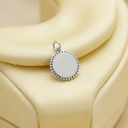 Oxidised beaded circle charm, silver-toned round pendant with bead border detail