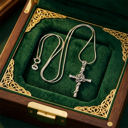 Silver rose thorn cross pendant on a chain with an attached bail