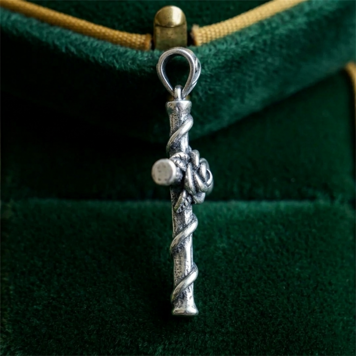 Silver rose thorn cross pendant with teardrop bail and coiled twists