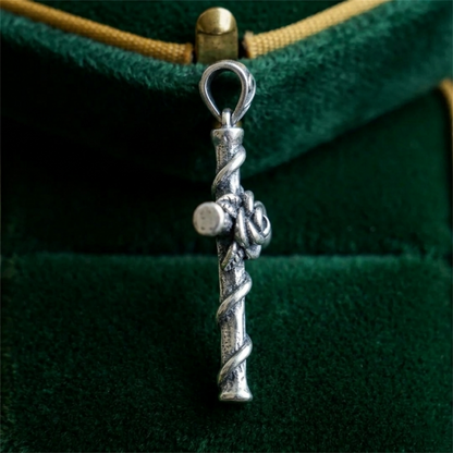 Silver rose thorn cross pendant with teardrop bail and coiled twists