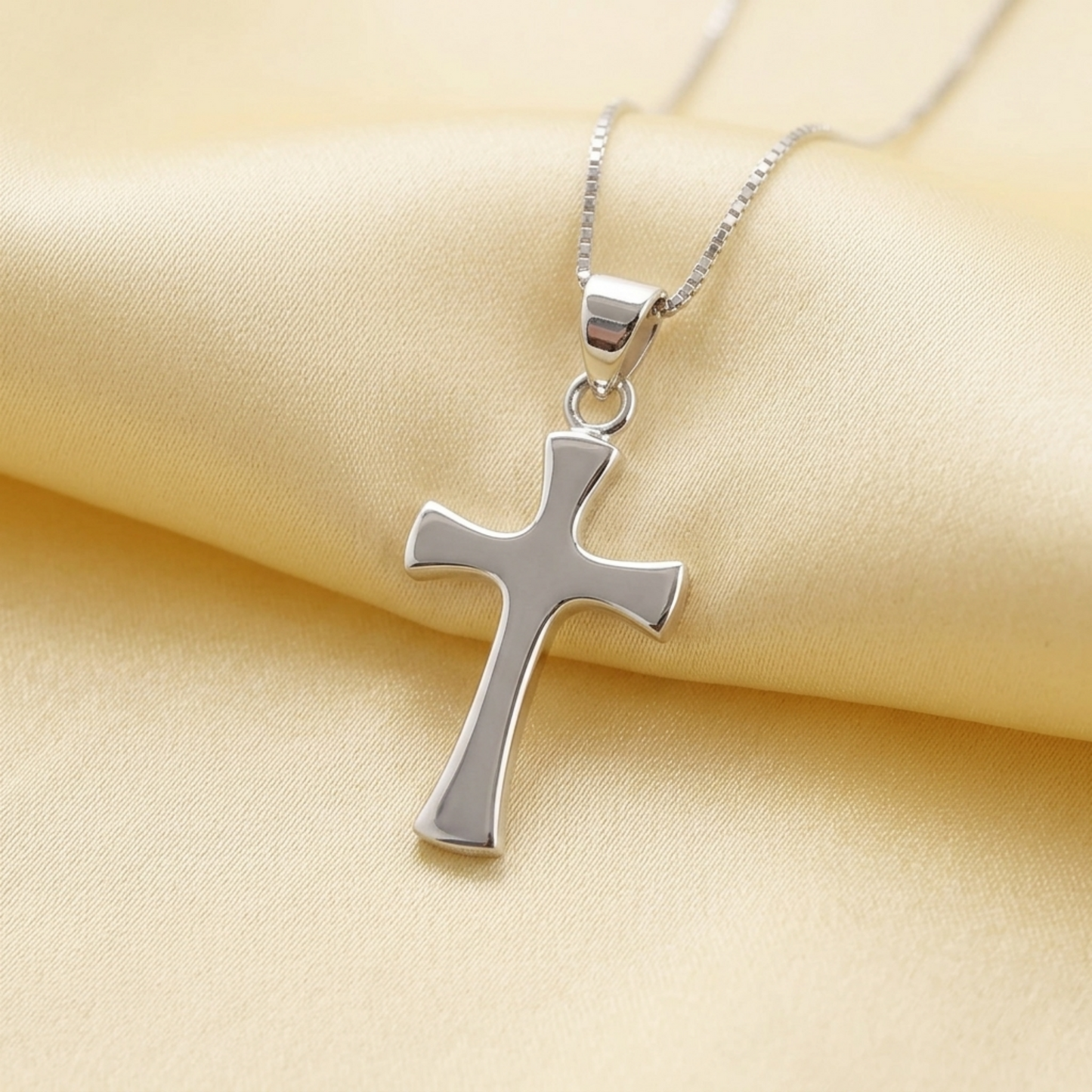 Cross pendant with bail on a silver chain necklace