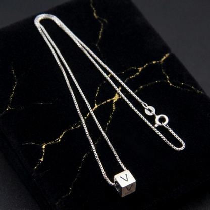 Silver chain necklace with silver cube charm engraved V