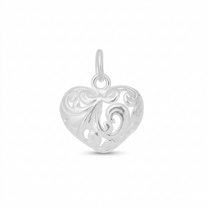Silver heart pendant with filigree floral cutouts and top loop bail