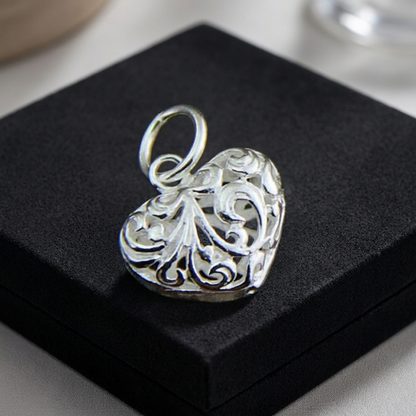 Silver heart pendant charm with detailed filigree floral engraving