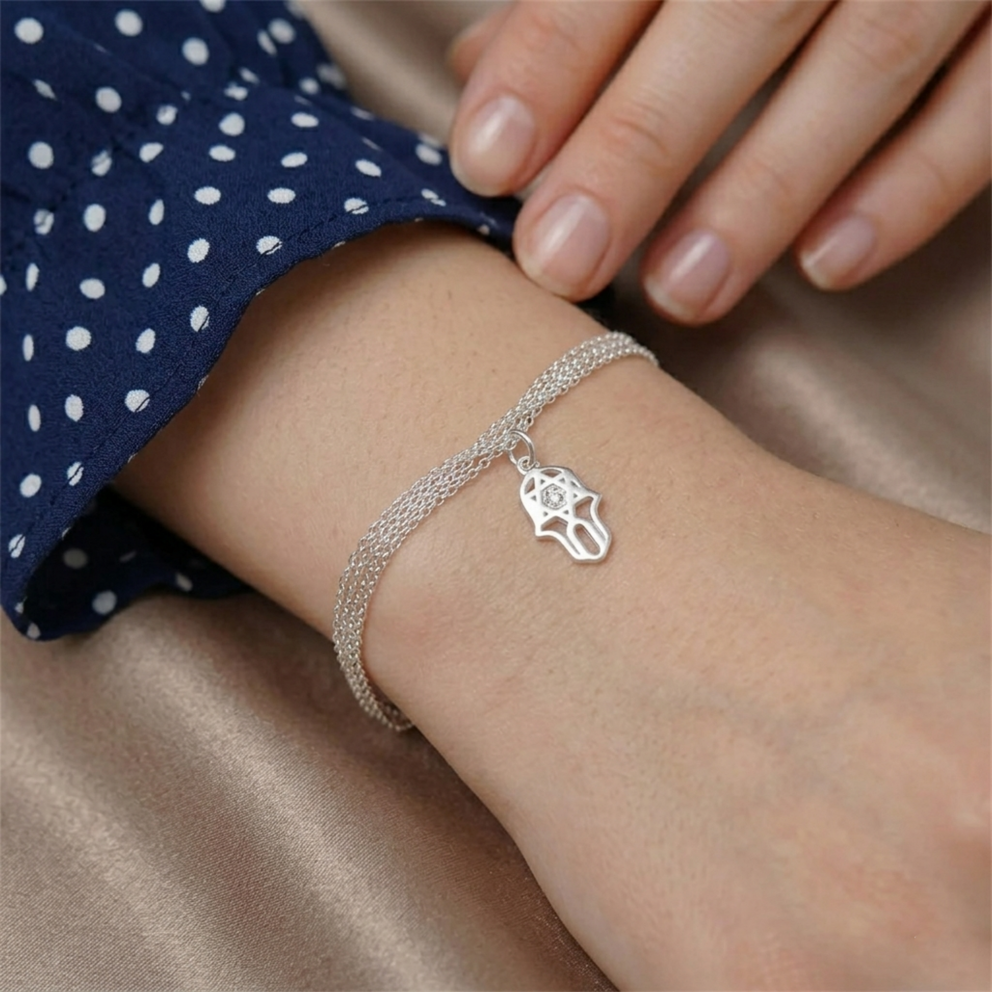 Silver bracelet with hamsa protection charm pendant and clear stone
