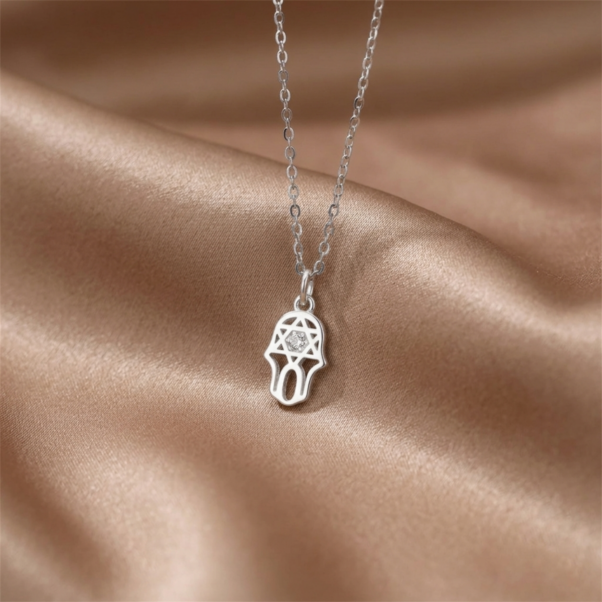 Silver necklace with hamsa protection charm pendant and clear stone