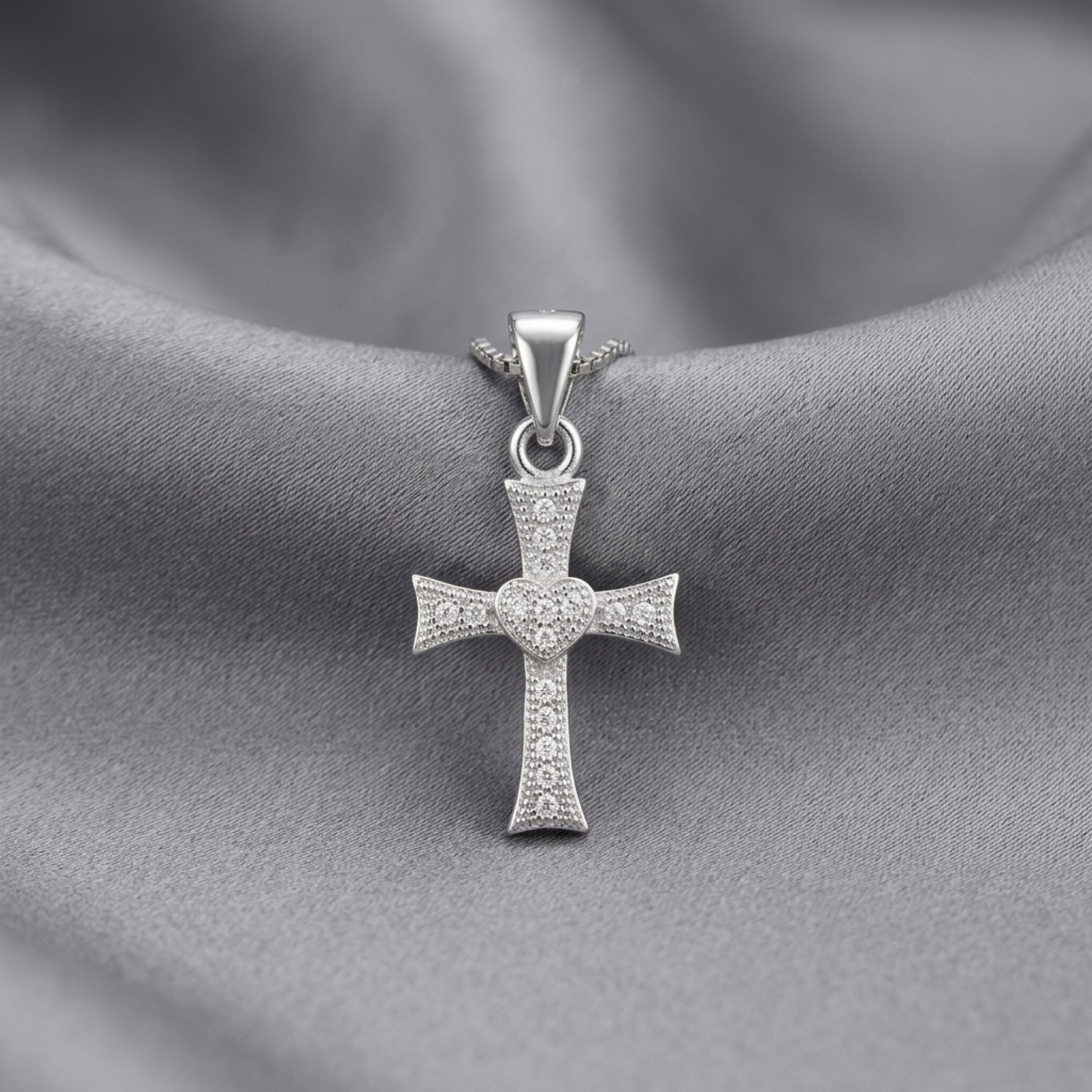 Silver heart-cross pendant with dangling bail and CZ pavé details