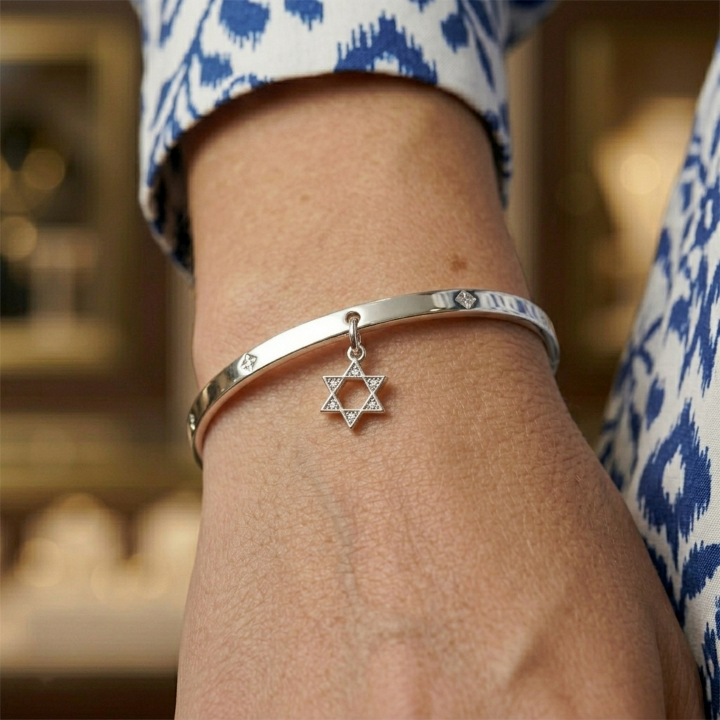 Star of David pendant necklace on silver-tone bangle with clear-stone hexagram charm