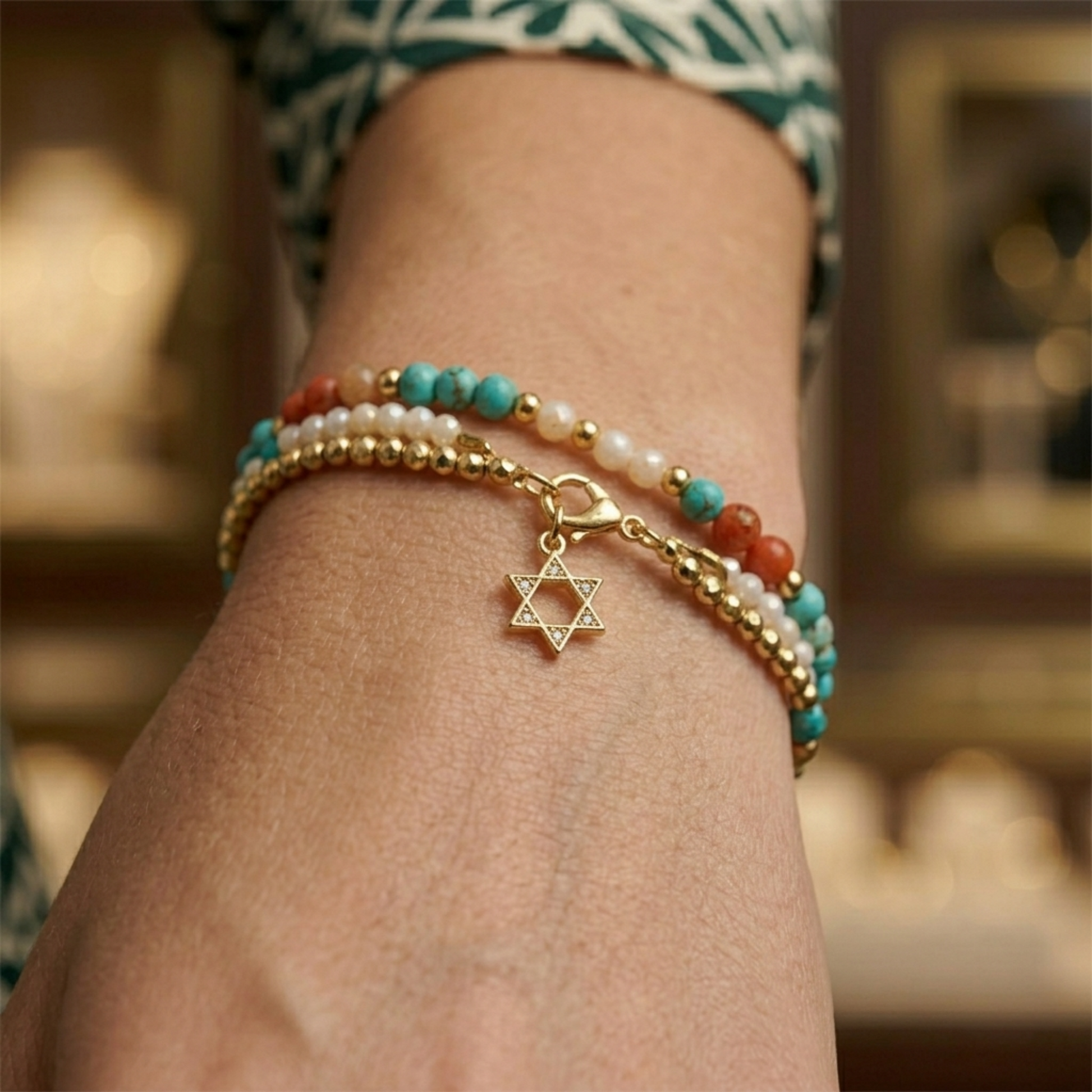 Star of David pendant necklace on gold-tone bangle with small hexagram charm