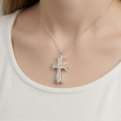 Cross pendant necklace with small silver cross and crystal details, on a thin chain