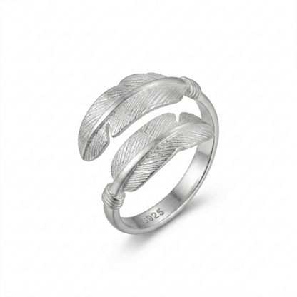 Wide open band ring with two feather motifs, textured silver tone