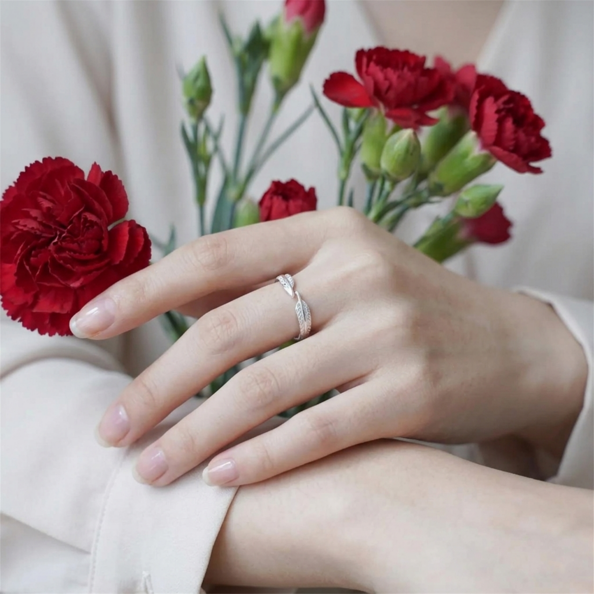 Silver feather wing open ring on finger with slim stacked look