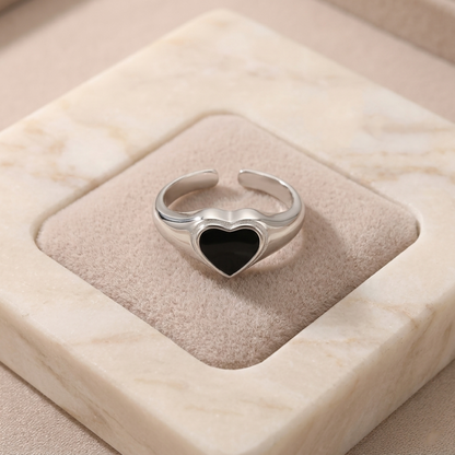 Silver heart ring with black heart bezel setting
