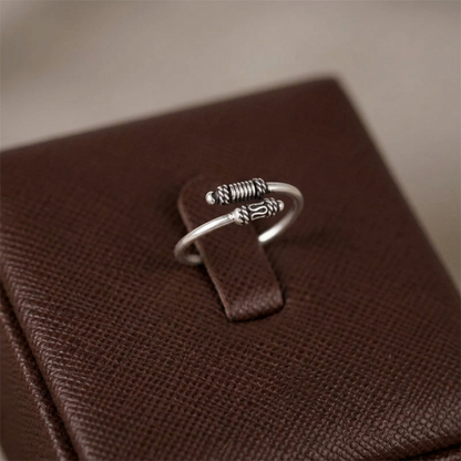 Oxidized silver totem knot ring, openwork ridged band with raised knot emblem