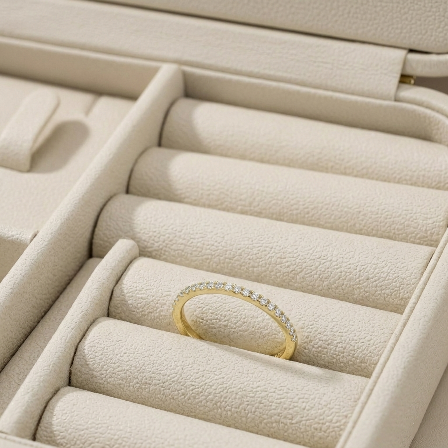 18K gold pavé stack ring in ring box, slim band with pavé stone row.