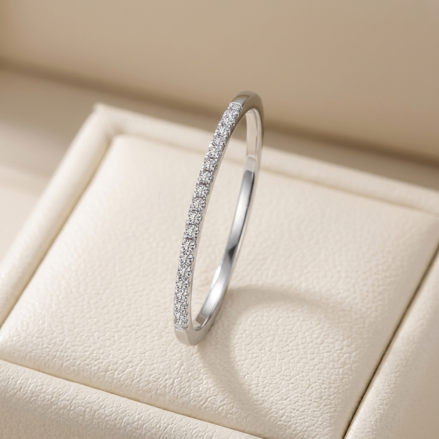 Rhodium pavé stack ring front view, full hoop covered in small stones.