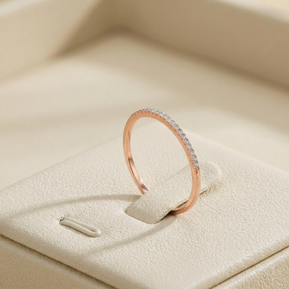 Rose gold pavé stack ring with pavé stones along the outer edge of the band.