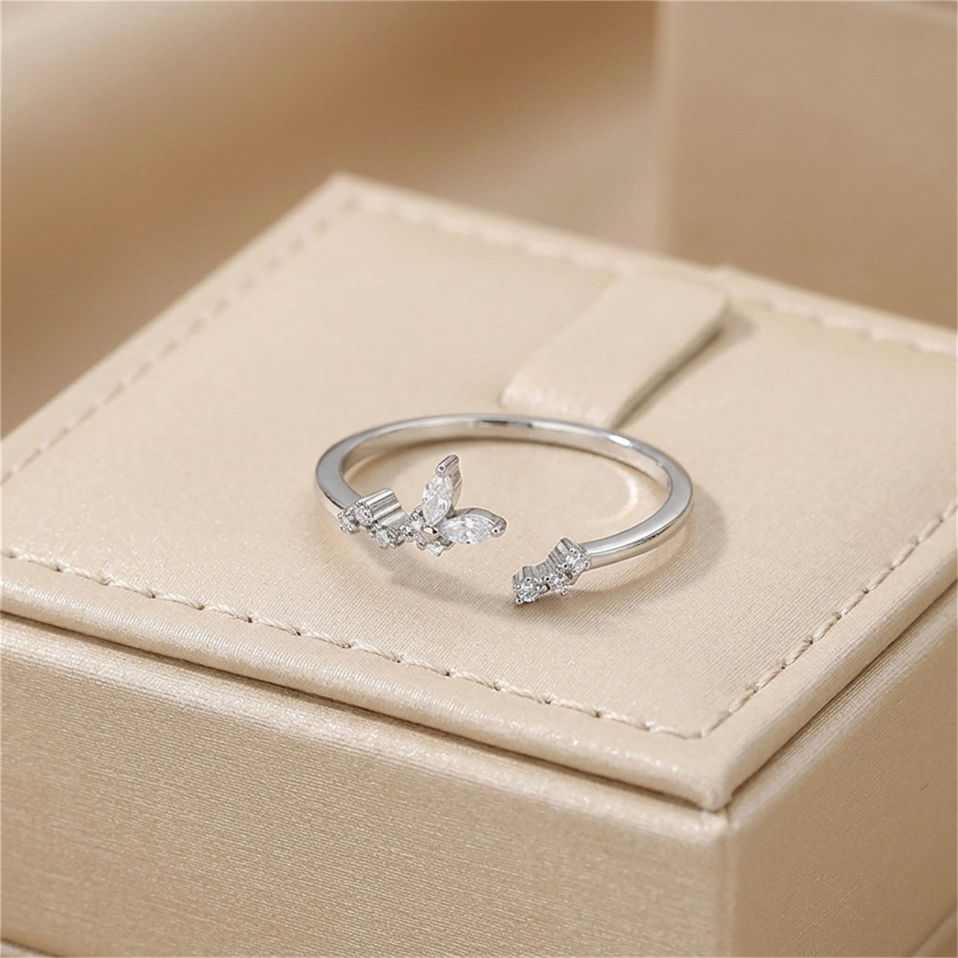 Silver CZ butterfly ring with two butterfly clusters on slim band