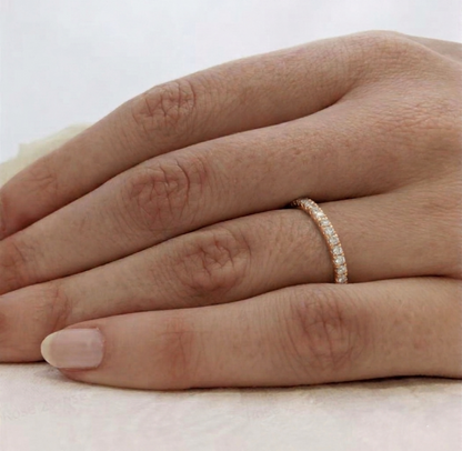 CZ stacking eternity band ring in gold tone on hand, set with round sparkle stones