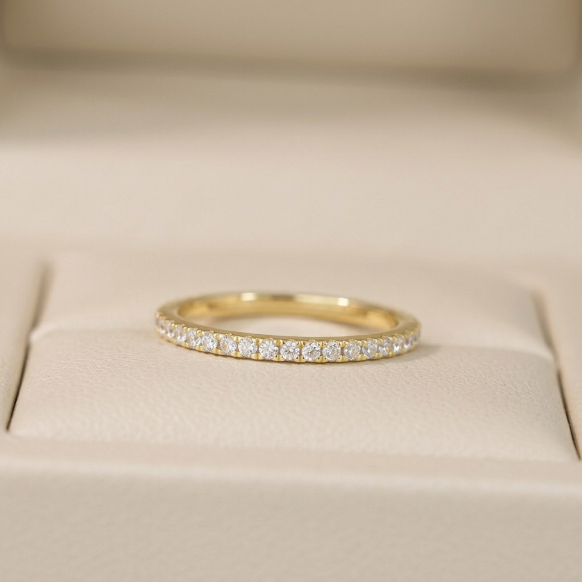 CZ stacking eternity band ring in gold tone with a full row of round sparkle stones