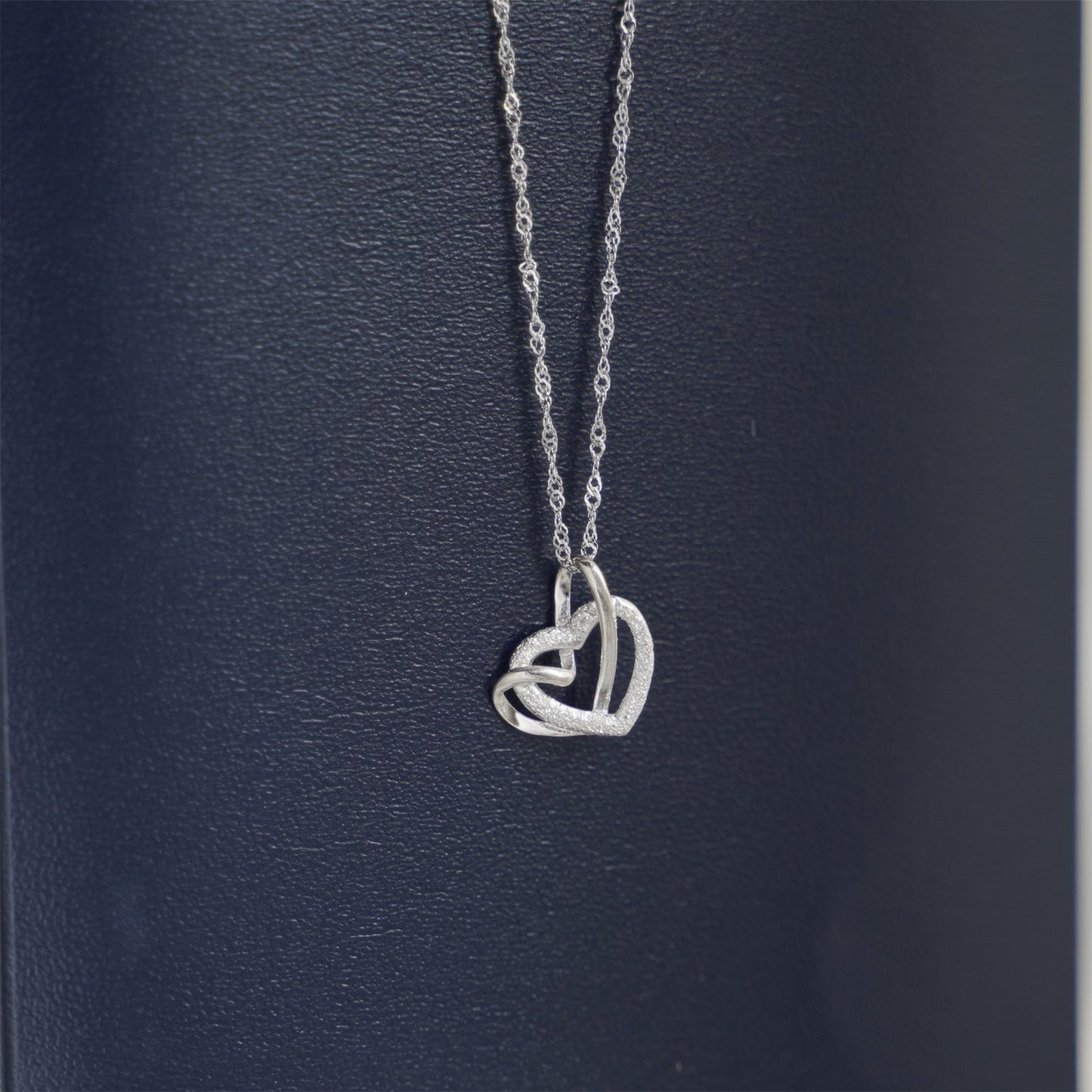 Sterling Silver Love Knot Necklace with Floating Sandblasted Heart Charm - sugarkittenlondon