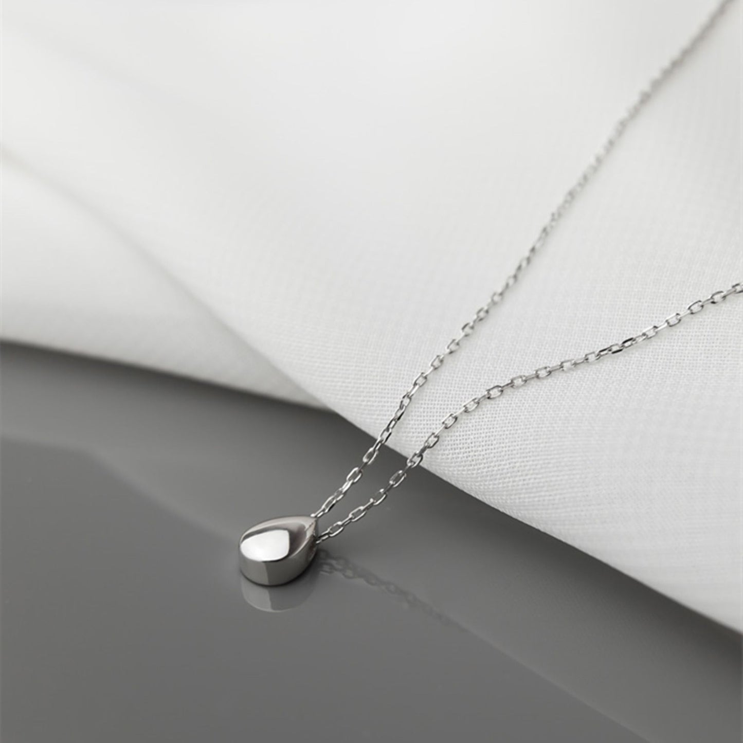 Rhodium-plated Sterling Silver Teardrop Necklace with Shiny Dome - sugarkittenlondon