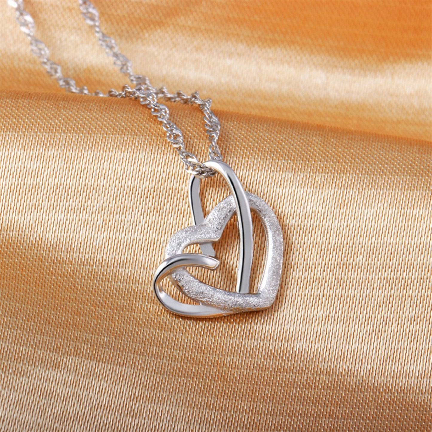 Sterling Silver Love Knot Necklace with Floating Sandblasted Heart Charm - sugarkittenlondon