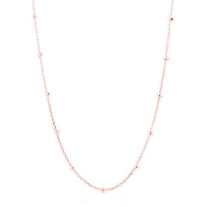 Rose gold beaded satellite chain necklace with small bead links and curved neckline.