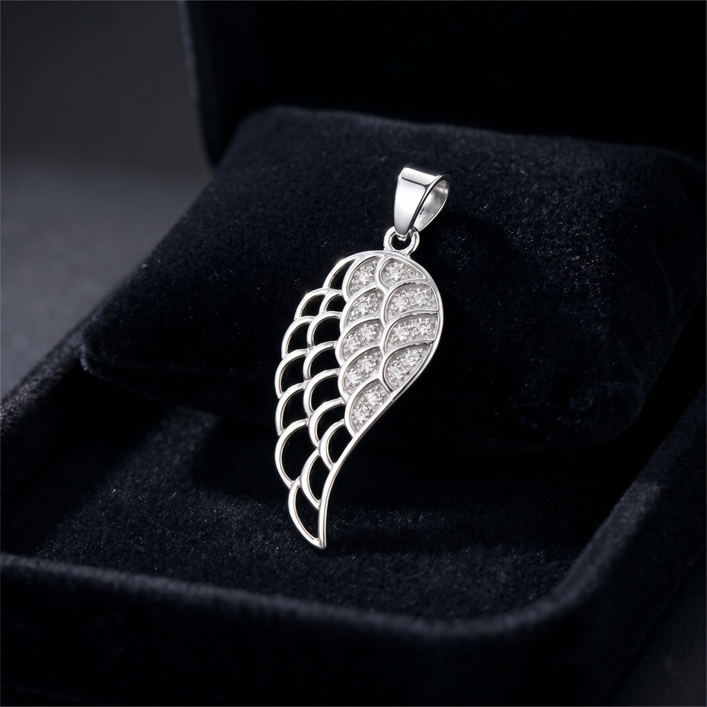 Single angel wing pendant with pavé stones and hinged bail clasp