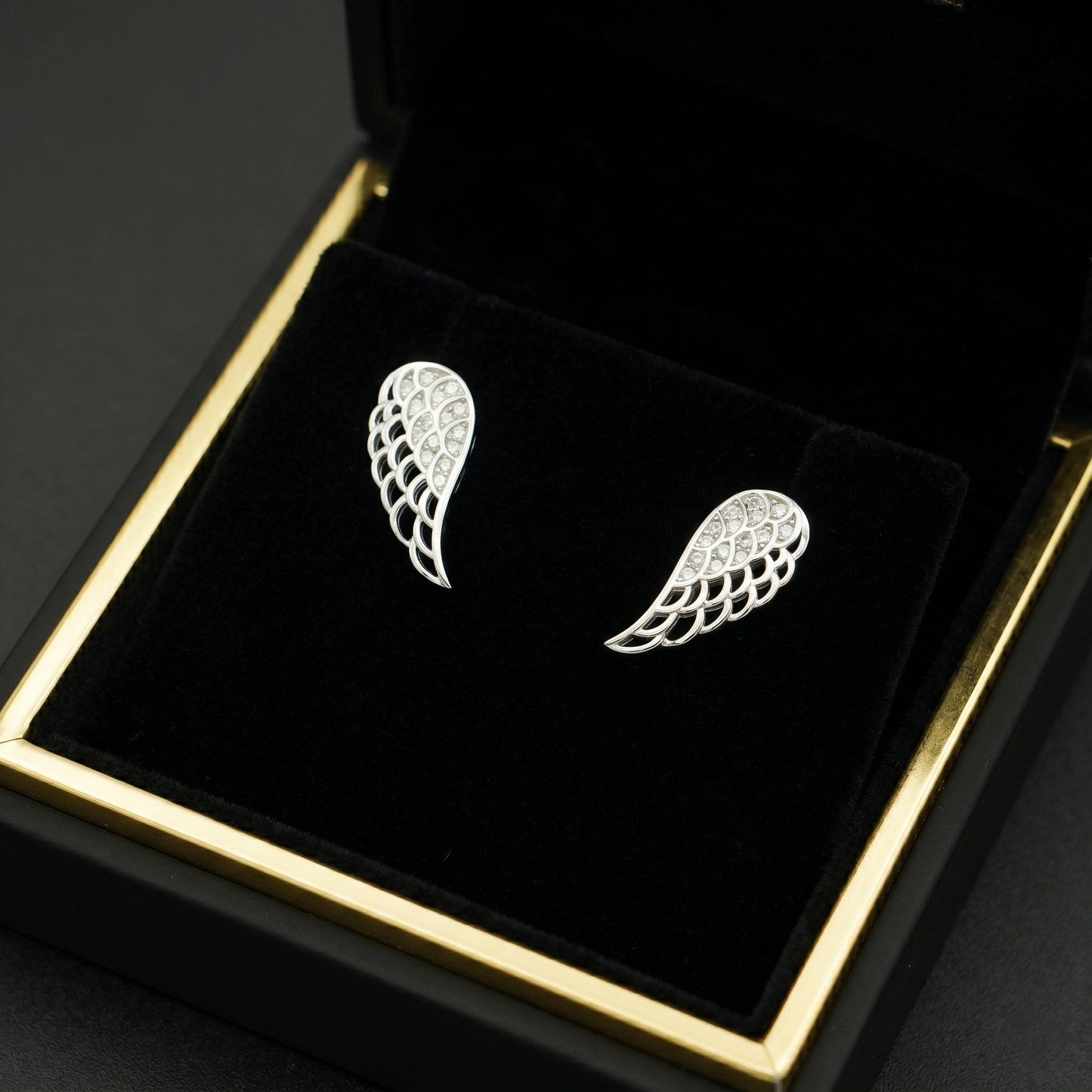 Angel wing stud earrings, paved single-wing style with layered scallop detailing
