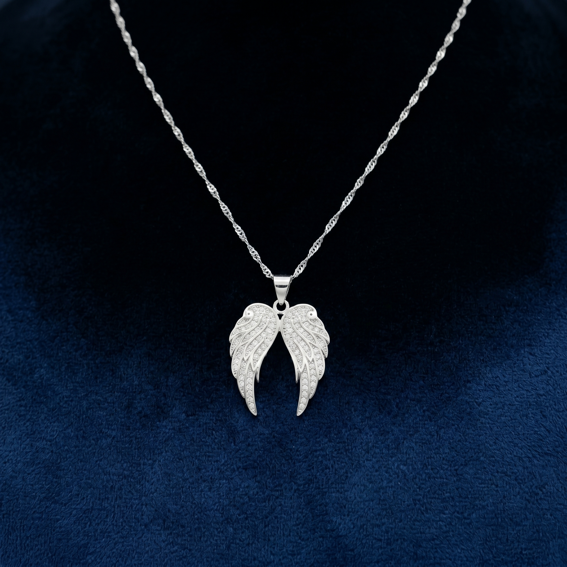 Double angel wing necklace pendant with pavé stones on a thin chain